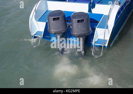 Boat engines tune up  rear view of speed boat running. Stock Photo