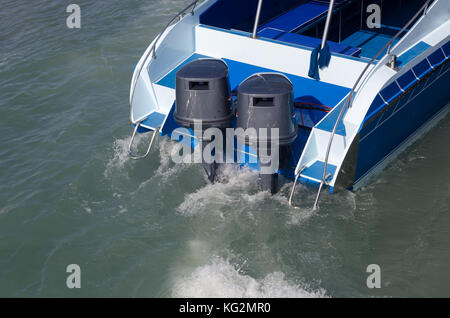 Boat engines tune up  rear view of speed boat running. Stock Photo