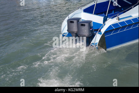 Boat engines tune up  rear view of speed boat running. Stock Photo