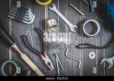 Joinery tools on a dark wooden table. Place for the text. A concept for Father's Day. Top view. Flat laying. Stock Photo