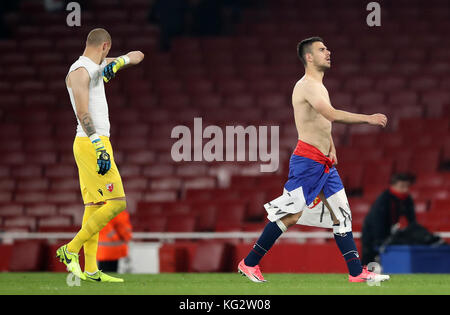 Red Star Belgrade's Marko Gobeljic (right) and Milan Borjanafter the final whistle during the UEFA Europa League match at the Emirates Stadium, London. Stock Photo
