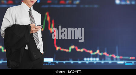 Businessman using mobile smart phone with increasing graph. Development and growth in stock market and business investment Stock Photo
