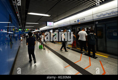 Commuters waiting on the Island line MTR platform in Admiralty station. Stock Photo