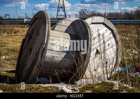 An empty cable reel is left on site. The problem of ecology Stock Photo