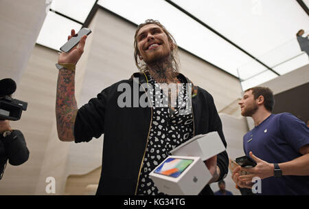 Marco Pierre White Jr holds his new iPhone X outside the Apple Store on Regent Street, London, as the new handset went on-sale in the UK. Stock Photo