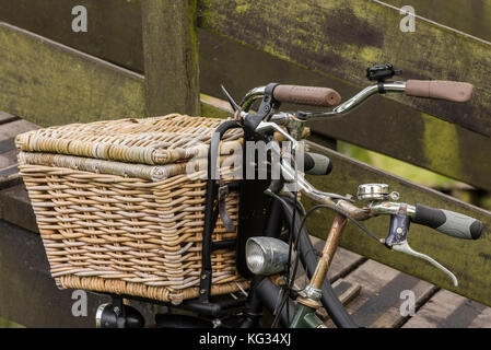 Two old Dutch bikes with wicker basket on the stering wheel. Stock Photo
