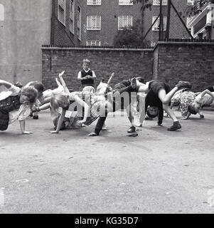 Primary School Playground. Girls Playing Hopscotch. South London Stock 