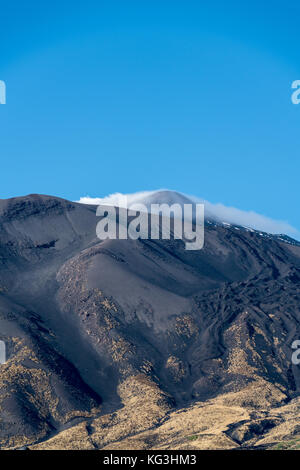 Summit of the volcano Etna, with steaming fumaroles against a clear blue sky, viewed from the north side of the mountain Stock Photo