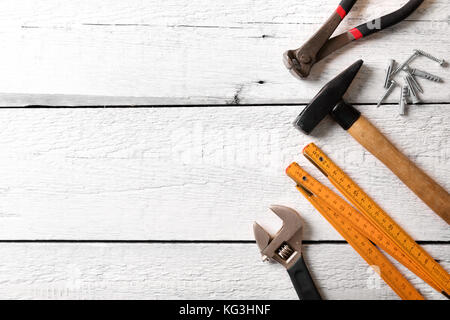 construction tools on white wood background with copy space Stock Photo