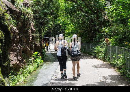 Two hikers on paved hiking trail in Hong Kong SAR Stock Photo