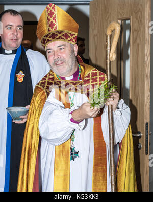 Right Reverend Stephen Cottrell, Lord Bishop of Chelmsford  in Essex. Spreading holy water as a blessing.  A Church of England Bishop Stock Photo