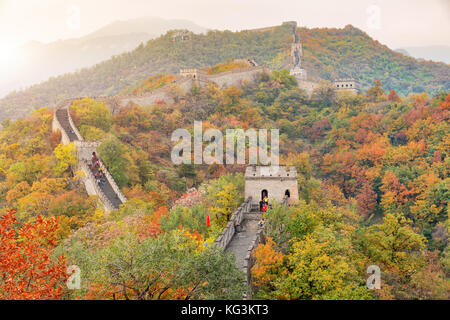 China The great wall distant view compressed towers and wall segments autumn season in mountains near Beijing ancient chinese fortification military l Stock Photo