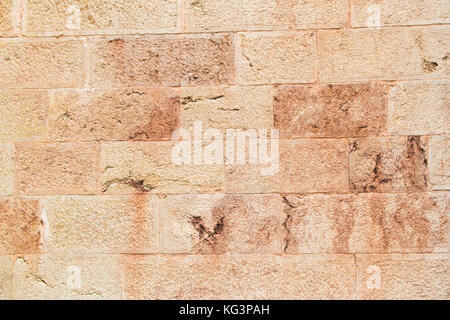 Wall from pink limestone. A laying on the old building Stock Photo