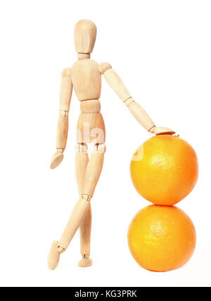 Wooden doll and oranges on a white background. The wooden dummy leans a hand on two oranges. It is isolated on white Stock Photo