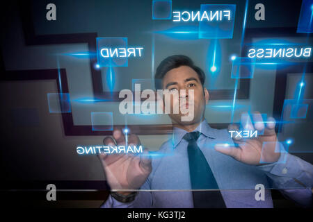 Businessman using futuristic computer keyboard Stock Photo