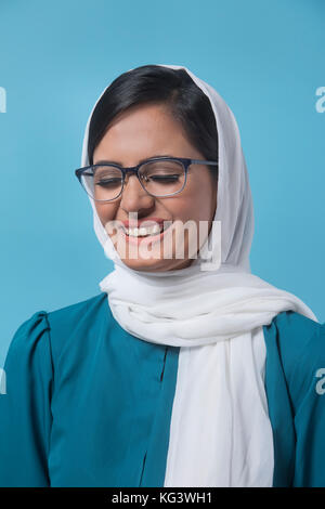 Woman In white dupatta eyes closed Stock Photo