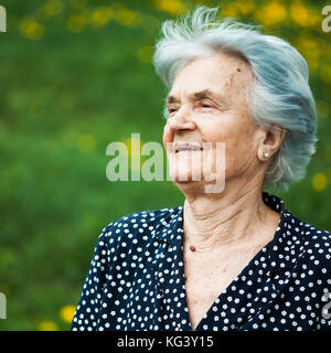 Outdoor portrait of happy senior woman. Stock Photo