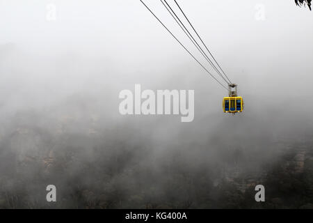 KATOOMBA, AUSTRALIA - SEPTEMBER 25 2015: The Scenic World Skyway comes out of the mist that swirls around the Blue Mountains, a World Heritage site in Stock Photo