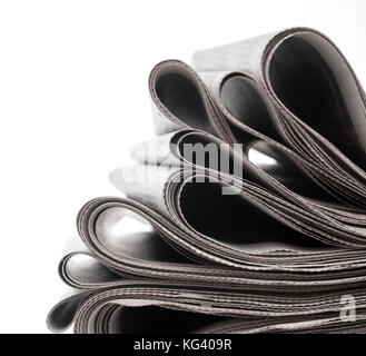 Newspapers folded and stacked concept for global communications Stock Photo