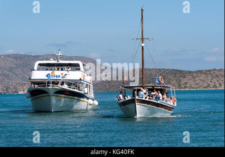 The Spinalonga Island ferry returns with passengers to the resort of Elounda, Crete, Greece. October 2017 Stock Photo