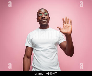 Happy Young Businessman Extending Hand To Shake Stock Photo