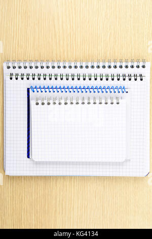 Stack of notebooks on a table Stock Photo