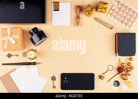 Workplace with empty space surrounded by office supplies. Christmas card and new year holidays template. Top view Stock Photo