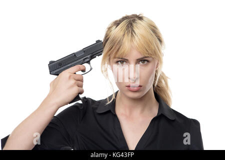 blonde haired business woman holding a gun up to her head Stock Photo