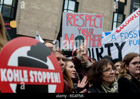 Bonn, Germany. 4th Nov, 2017. Demonstrators seen holding placards during the protest. According to organizers, 25,000 people from around the world demonstrate for climate justice and 100 percent renewable energy in harmony with nature.The 23th United Nations Climate Change Conference, Cop 23, will take place from 06 to 17 November 2017 in Bonn. Credit: Markus Heine/SOPA/ZUMA Wire/Alamy Live News Stock Photo