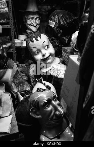Old bigheads are piled up in the storage of the Ingenio shop that is situated at the Rauric street of Barcelona. Date: 18/09/2015. Photo: Xabier Mikel Laburu. Founded in 1838 by a sculptor called Lambert Escaler. In 1924 the grandfather of Rosa Cardona buys the shop that is specialized in paper mache figures. Over the years they become a referent of their product creating many popular figures for the different village and city fests. Rosa will retire at the end of this year, and has no one to take over the business. Despite she says it is still a very profitable business, its complexity and si Stock Photo