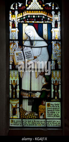 A memorial window in St. Michael and All Angels Church, All Stretton, Shropshire, England, UK Stock Photo