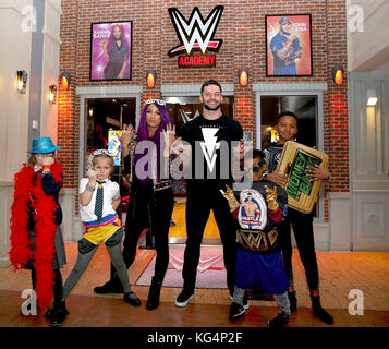 WWE Superstars Finn Balor and Sasha Banks meet children from Higham Ferrers Junior School school to launch the first ever WWE Academy at KidZania London. The new academy aims to encourage children to be creative and use their imagination by creating their own superstar personas. The WWE Academy is now open at KidZania London, a city built just for kids in Westfield. London, ShepherdÃs Bush. Stock Photo
