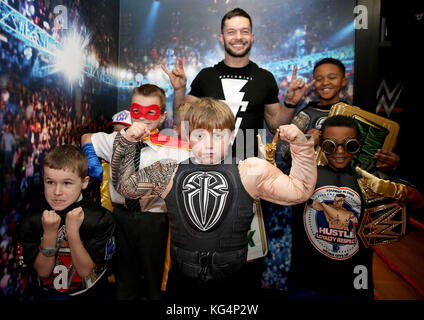 WWE Superstars Finn Balor and Sasha Banks meet children from Higham Ferrers Junior School school to launch the first ever WWE Academy at KidZania London. The new academy aims to encourage children to be creative and use their imagination by creating their own superstar personas. The WWE Academy is now open at KidZania London, a city built just for kids in Westfield. London, ShepherdÃs Bush. Stock Photo