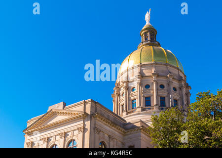 Bottom view of the tholobate and the dome of Georgia State Capitol on the background of clear sky, Atlanta, USA Stock Photo