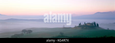 Italy. Tuscany. Early morning mist over panoramic landscape. Stock Photo