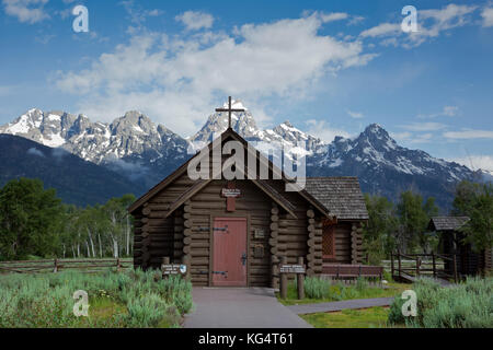 WY02530-00...WYOMING - Chapel of the Transfiguration, a small, historical log church in Grand Teton National Park with the Grand Teton behind. Stock Photo