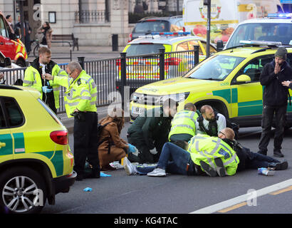 Road Traffic Accident Central London Motorcyclist injured and being treated by medics Stock Photo