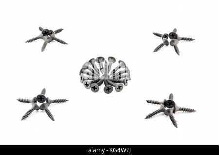 Four five-pointed stars and a circular composition are lined with black Oxidized self-tapping screw isolated on white background Stock Photo