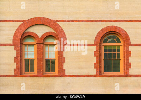 Two windows in a row on facade of Flagler College front view, Saint Augustine, USA Stock Photo