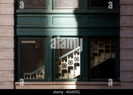 Detail of building window and stairway on 18th street near sixth avenue in New York City.