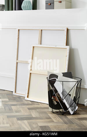 empty canvas creative decoration on parquet flooring Stock Photo