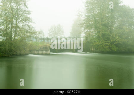 Weir and fog on the Kennet and Avon canal, long exposure image