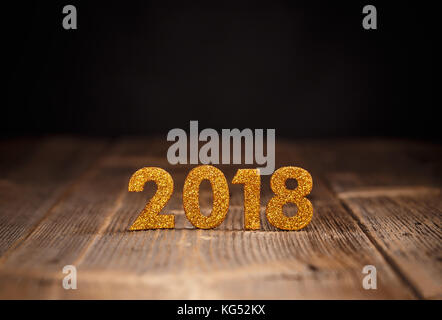 2018 year golden figures on wooden background Stock Photo
