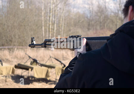 Shooting from a machine in the dash.Checking the reliability of weapons and shooting accuracy. Stock Photo