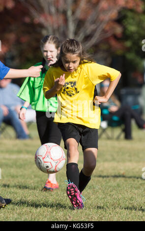 A 9 yr. old girl in a youth soccer match in Moretown, Vermont Stock Photo