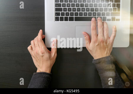 cyber security internet and networking concept.Businessman hand working with laptop computer Stock Photo