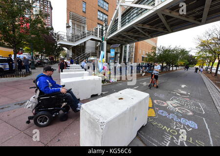 Manhattan, United States. 03rd Nov, 2017. Concrete blocks in place to prevent recurrence. Impromptu memorials were placed at the corner of Chambers and West Streets to honor victims of the attack by Sayfullo Saipov on behalf of ISIS. Along with flowers and candles, NYPD was placing concrete barriers to prevent further attacks. Credit: Andy Katz/Pacific Press/Alamy Live News Stock Photo