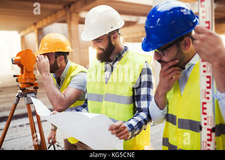 Portrait of construction engineers working on building site Stock Photo