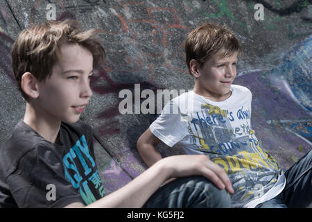 Two boys in the skate park Stock Photo