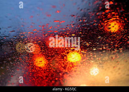 view through windscreen, early morning rush-hour traffic in the rain, Essen, Ruhr area, North Rhine-Westphalia, Germany Stock Photo